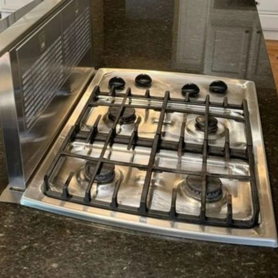 Stove top before and after professional cleaning by Catherine's Cleaning